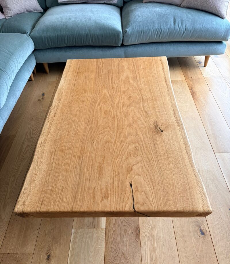 Looking down on the single-slab French oak top, showing the grain and the natural waney edge