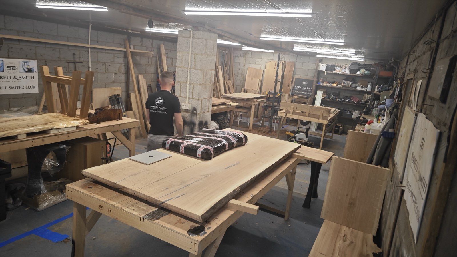 Inside the Timber Row workshop in Wickford, Essex — oak tops on the benches, mid-build